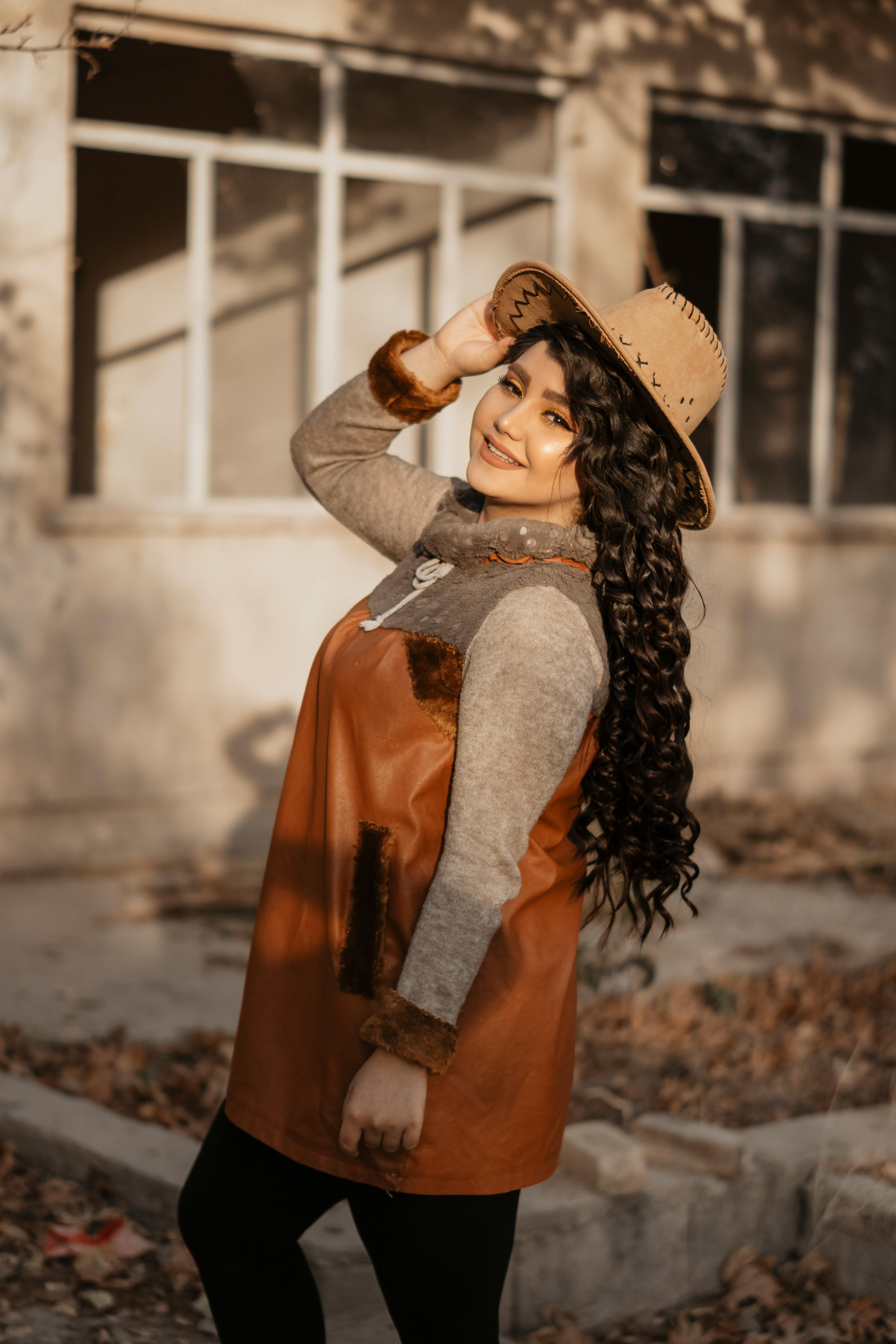 Pretty young female denim clothing fashion posing cap studio model