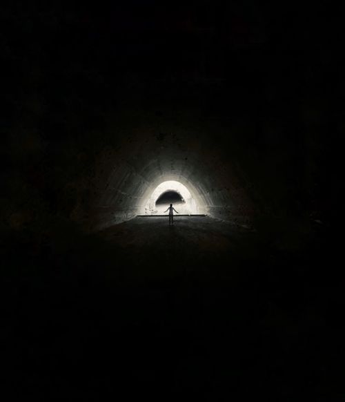 Free Shadowy figure in a dark tunnel in Ullensaker, Norway, creating a mysterious atmosphere. Stock Photo