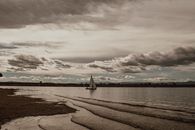 White Sail Boat on Sea Under Cloudy Sky