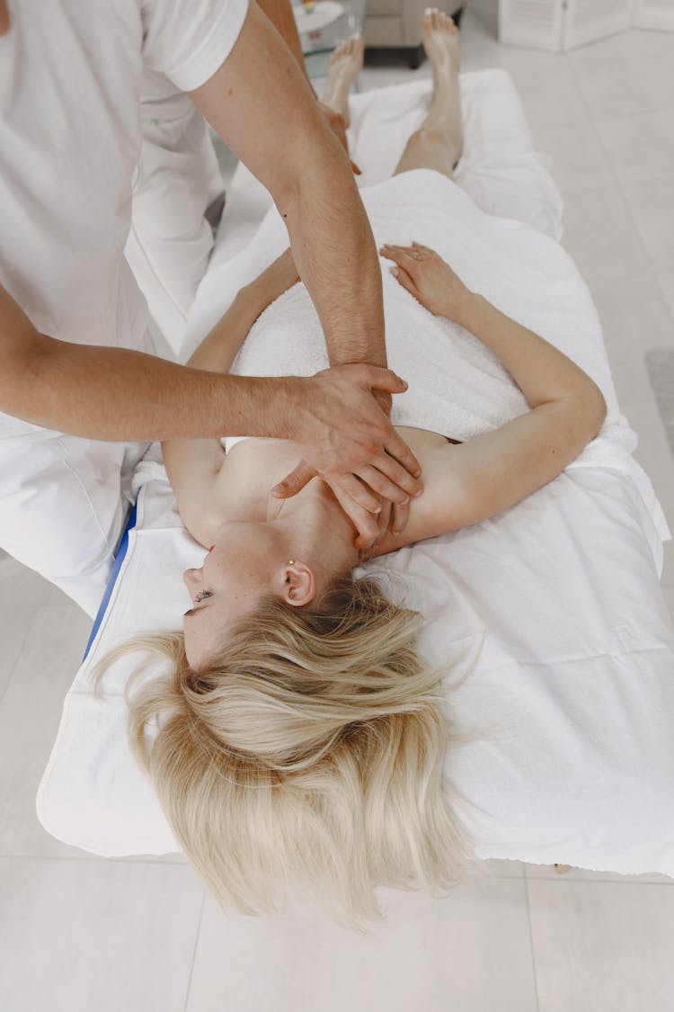 Man Doing Massage Therapy On Woman