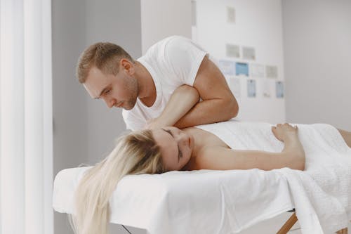 Man Giving Massage to Woman