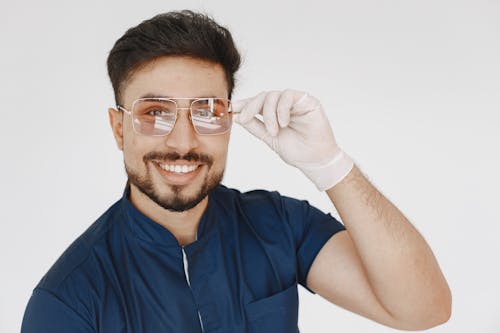 Man in Blue Scrub Suit  Wearing Sunglasses