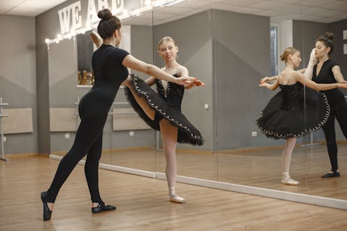 Free Young Ballerina Dancing with Her Teacher Stock Photo