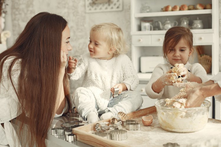 Family Making A Cake Together 