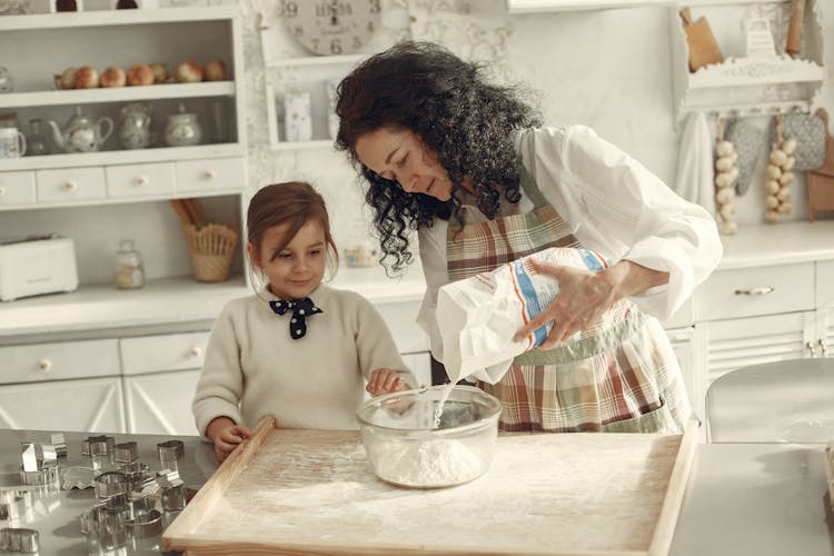 Mother And Daughter Baking Together