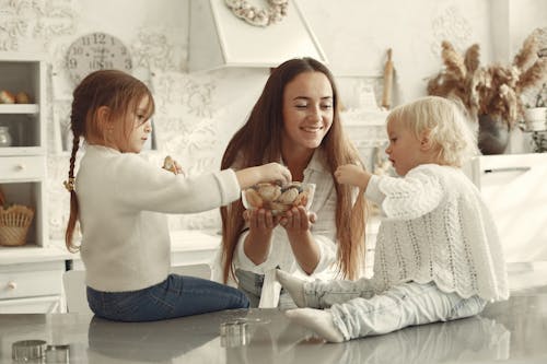 Free Kids Taking Baked Goods from a Glass Bowl Stock Photo