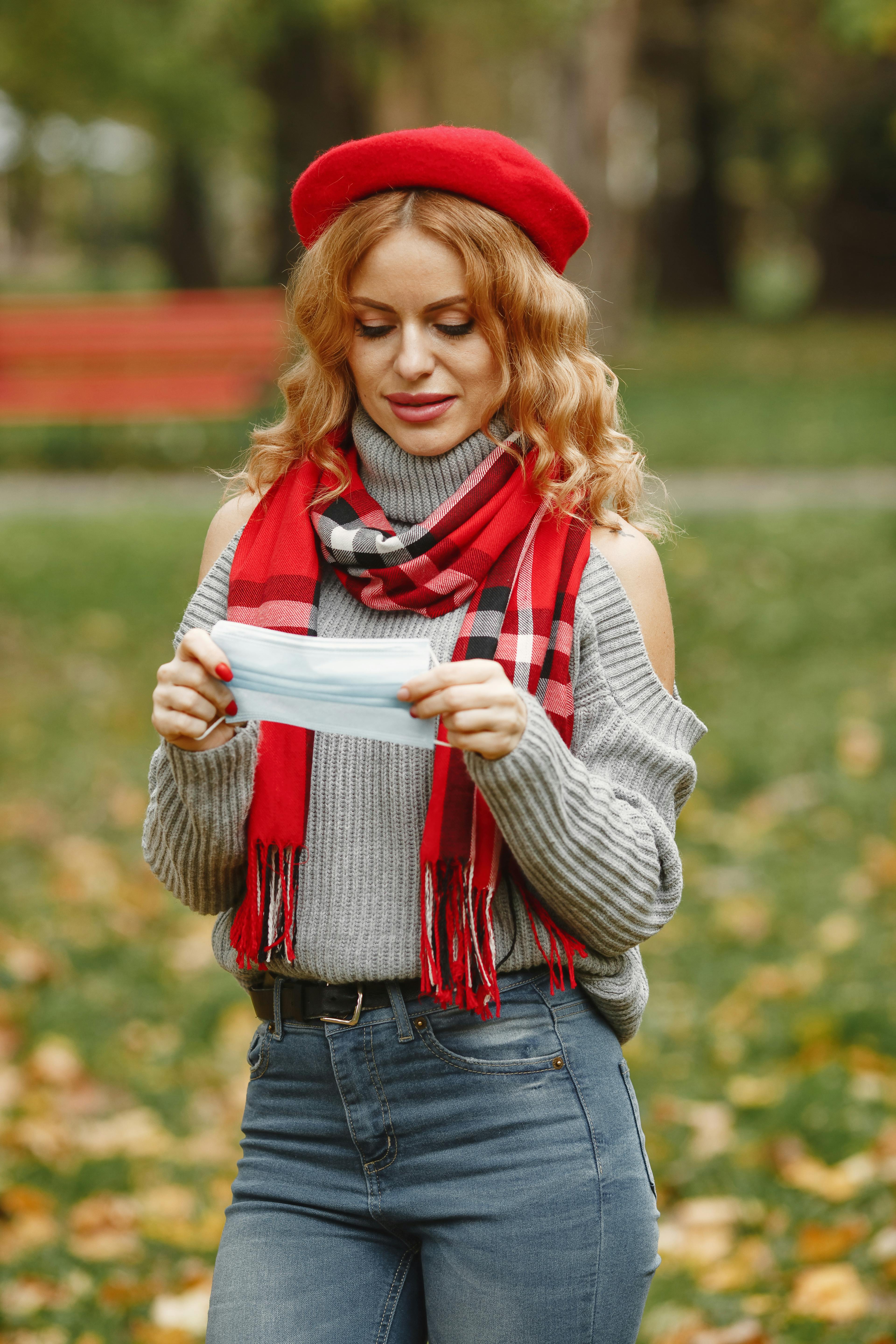 girl in white and red scarf and blue denim jeans