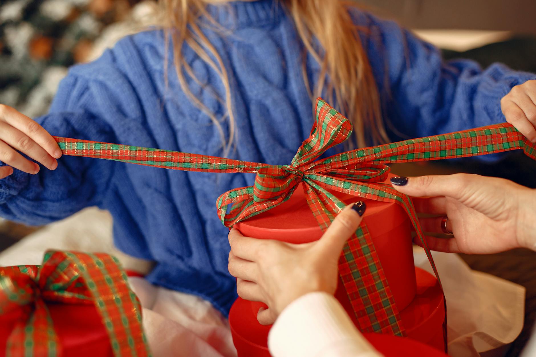 Girl Unwrapping Christmas Gifts