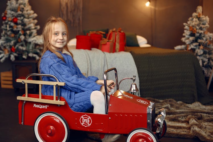 Portrait Of Smiling Girl In Retro Car