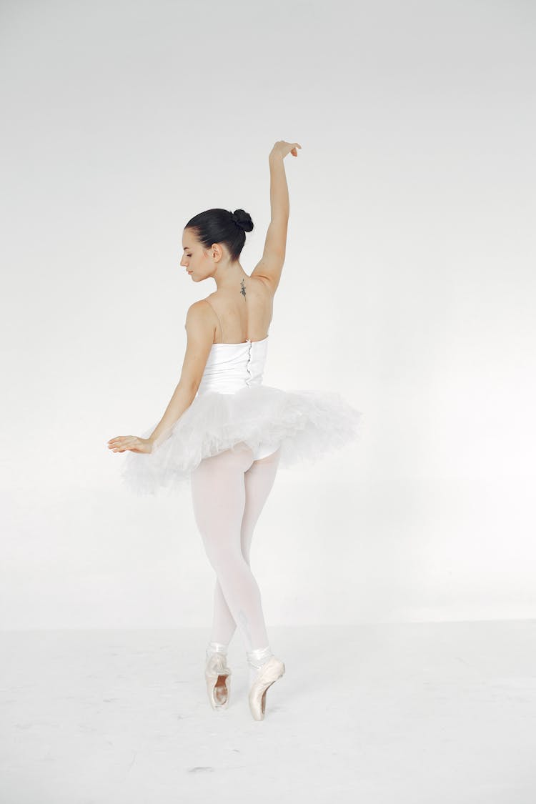 Ballerina Dancing In White Tutu