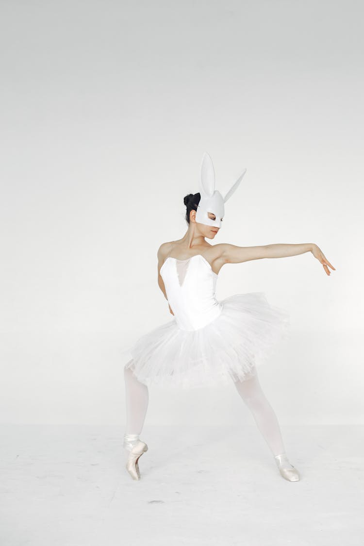 Ballerina Dancing In White Rabbit Mask