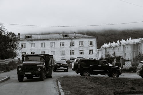 Vehicles parked near houses