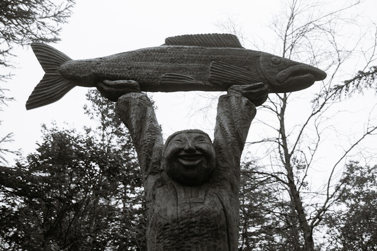 Sculpture Of Man With Big Fish