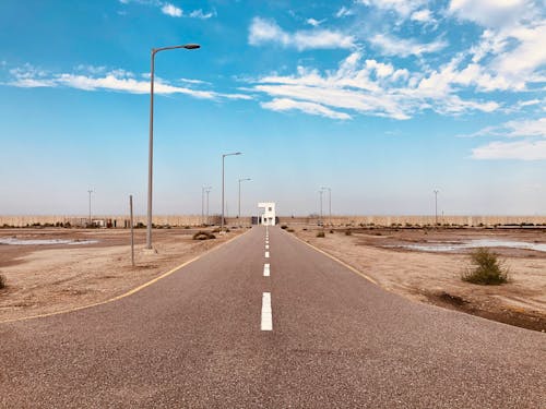 Free Empty Road Under Blue Sky Stock Photo