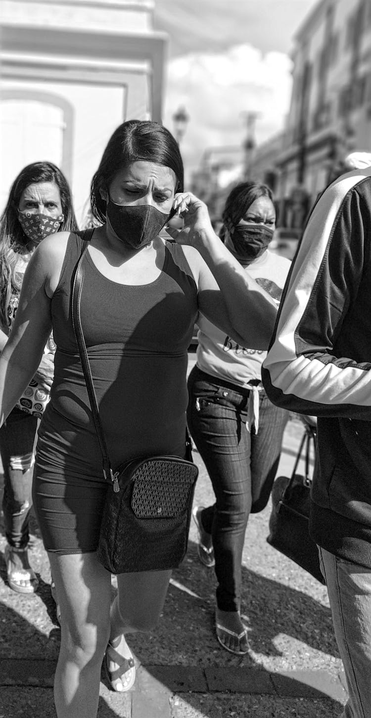 Women In Face Masks Marching Through Streets