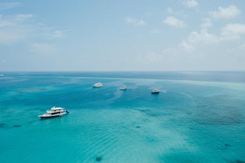 Modern yachts floating on azure seawater