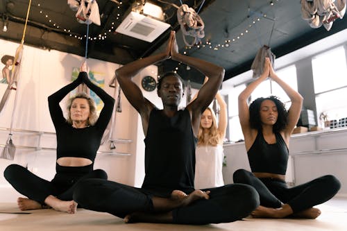 People Meditating in a Yoga Class