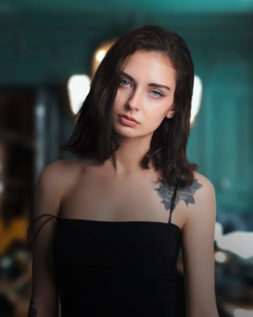 Beautiful Woman in Black Tank Top With Tattoo