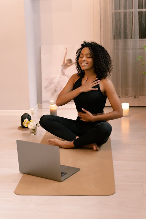 Free Woman with Curly Hair Doing Yoga Stock Photo