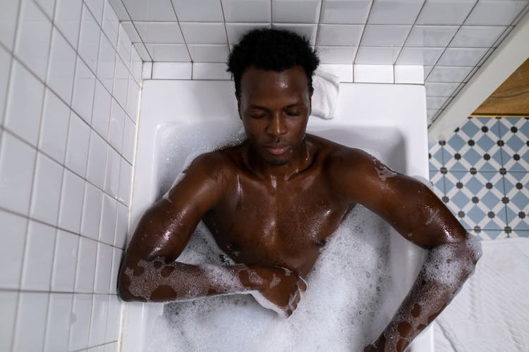 Man Relaxing In The Bathtub