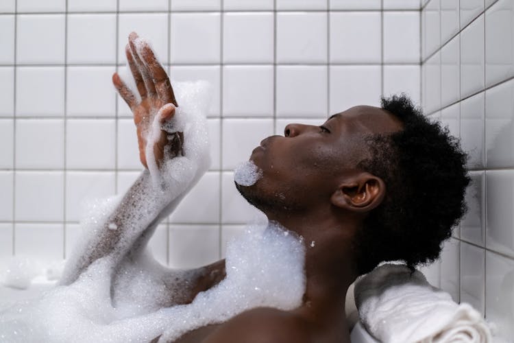 Man In Bathtub With Bubbles