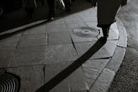 People walking on sidewalk of city street