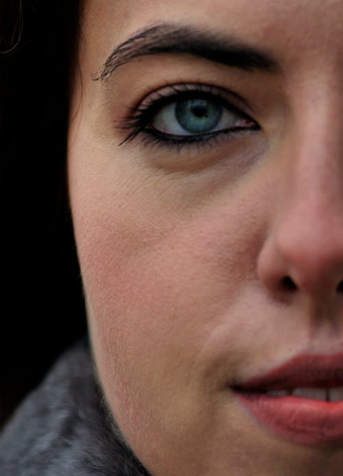 Portrait of a Woman with Blue Eyes and Black Hair