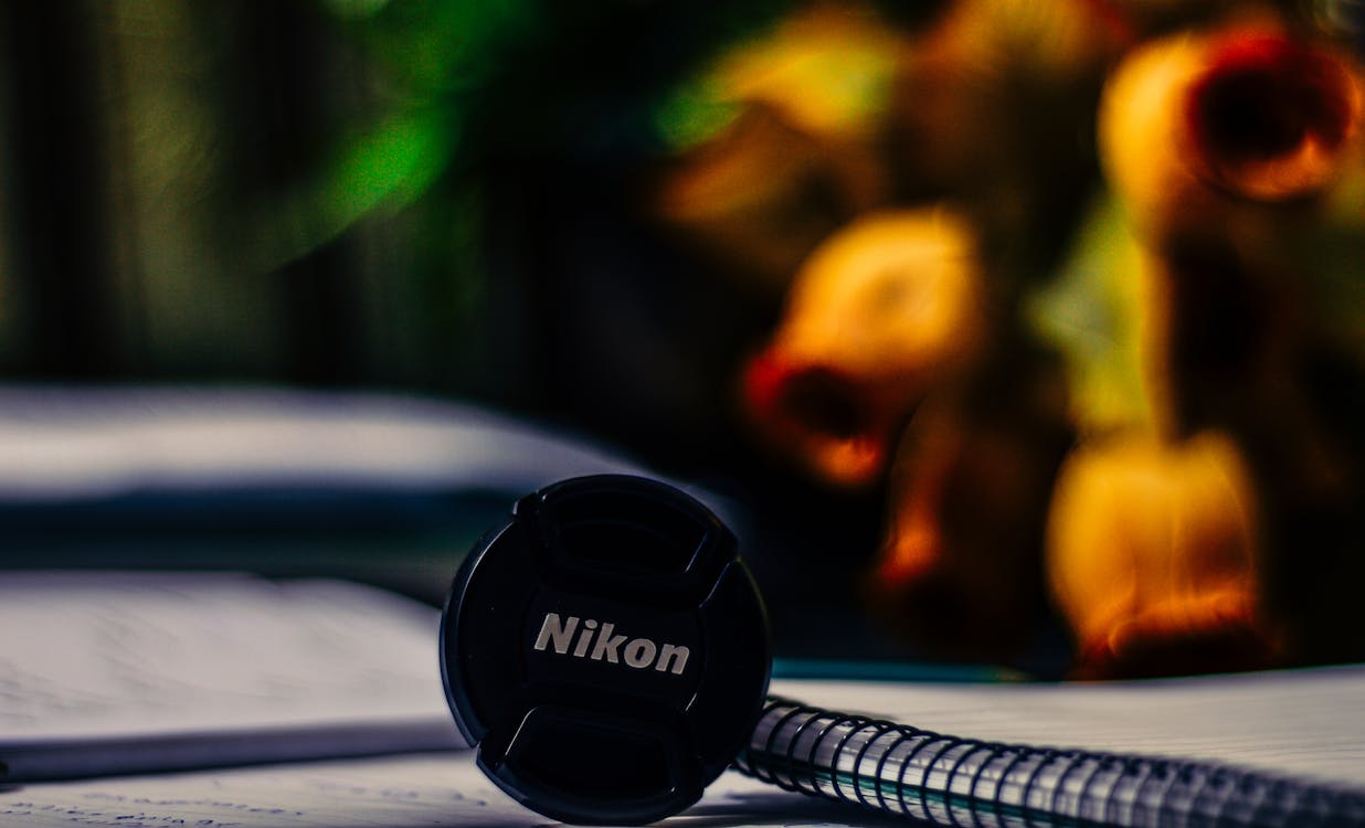 Безкоштовне стокове фото на тему «Nikon, блокнот, кепка» стокове фото