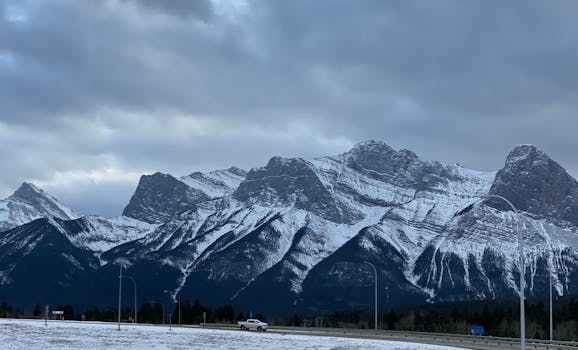 Stunning winter view of snow-capped Rocky Mountains in Canmore, Alberta, Canada.
