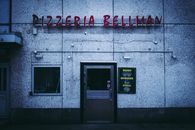 Pizzeria Bellman Red Signage Outside the Restaurant Wall