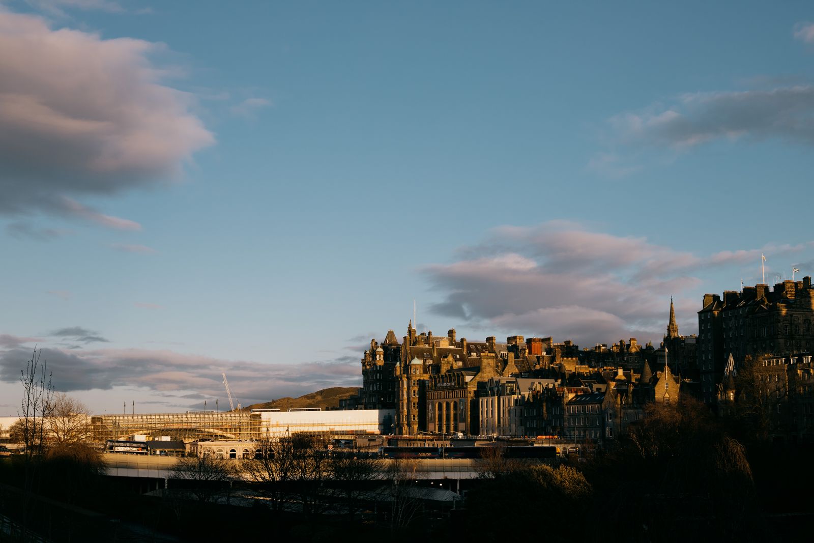 Edinburgh skyline and historic Old Town rooftops at sunset, the area our partners cover