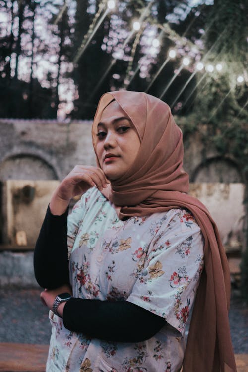 Woman in Brown Hijab and Floral Shirt 