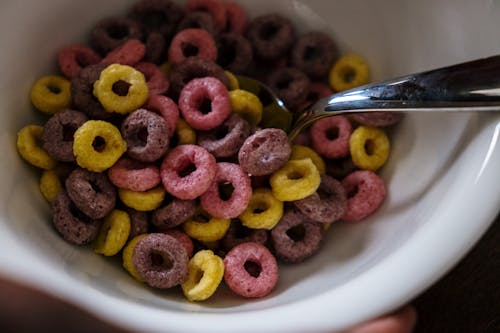 Free Close-Up Shot of Brown and Pink Round Cereals Stock Photo