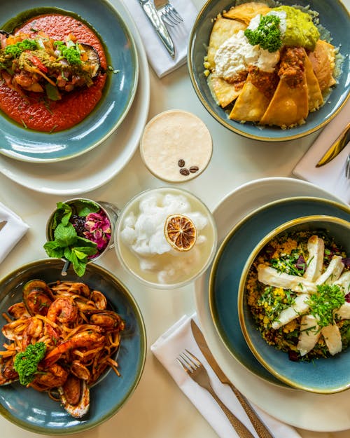 Cooked Food on Green Ceramic Bowls