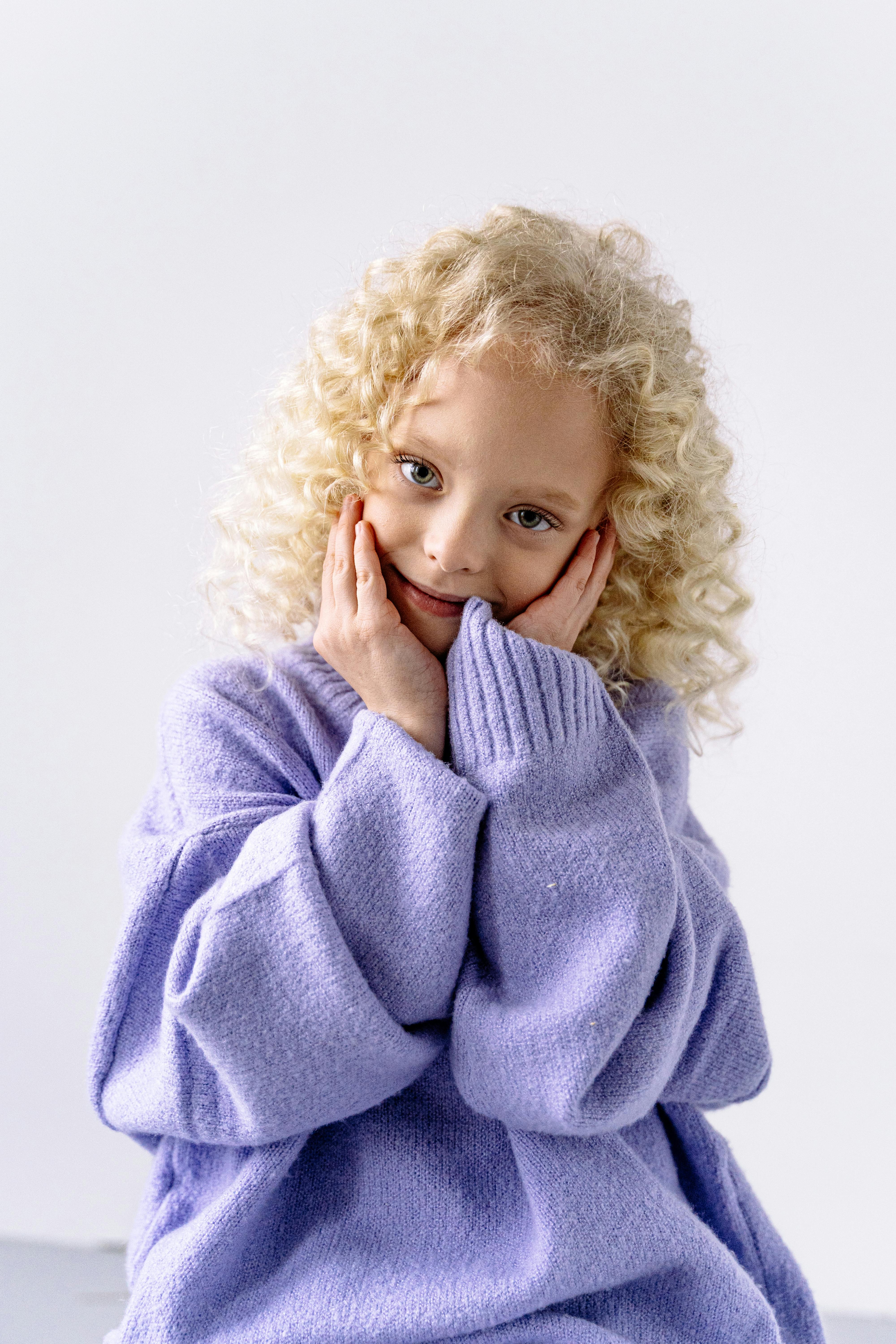 girl in purple knit sweater