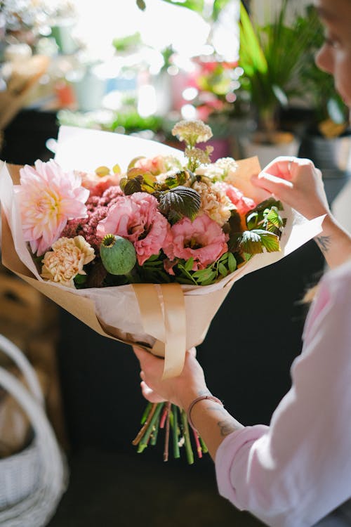 A Woman Holding a Bouquet of Flowers