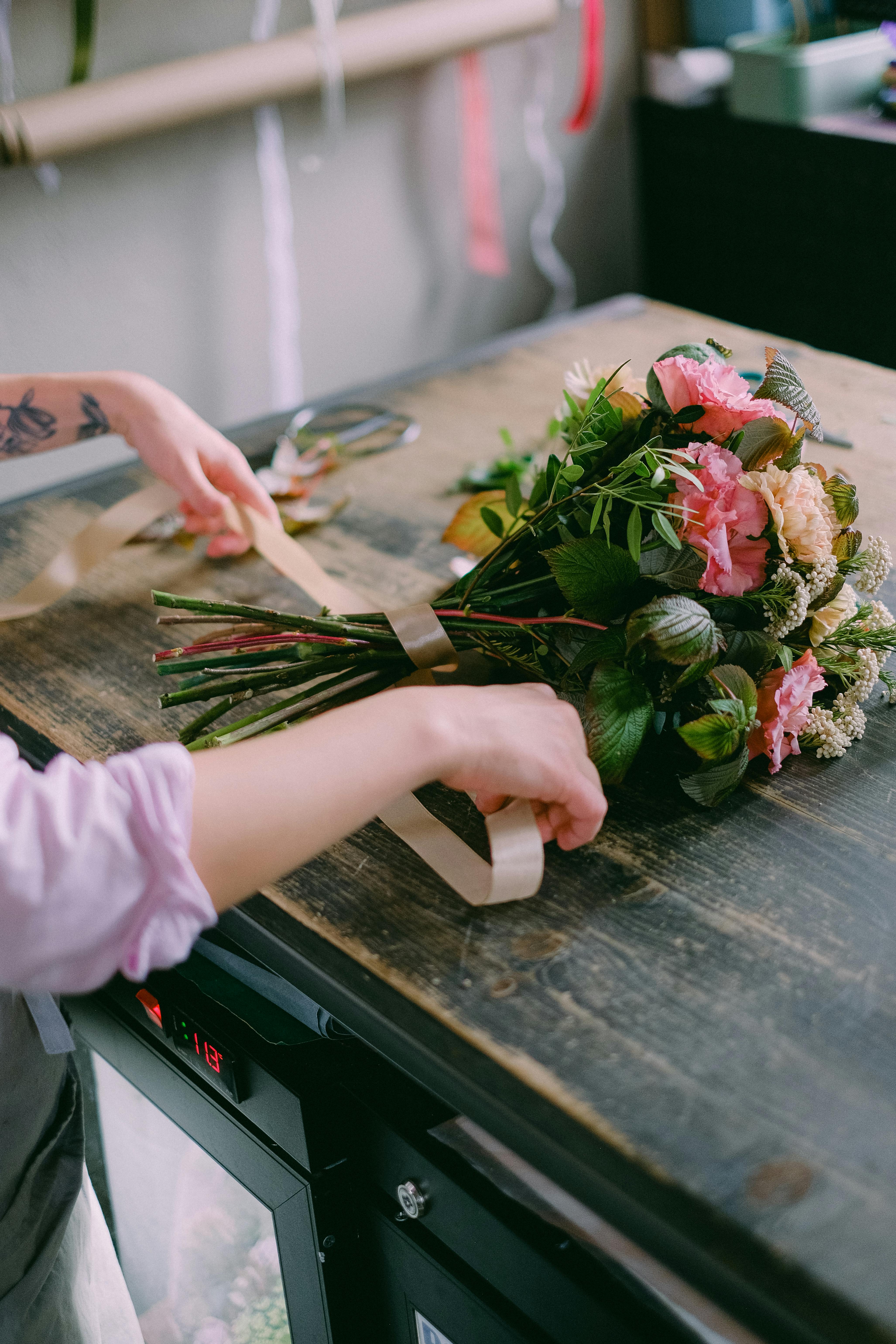 A Person Arranging Flowers · Free Stock Photo