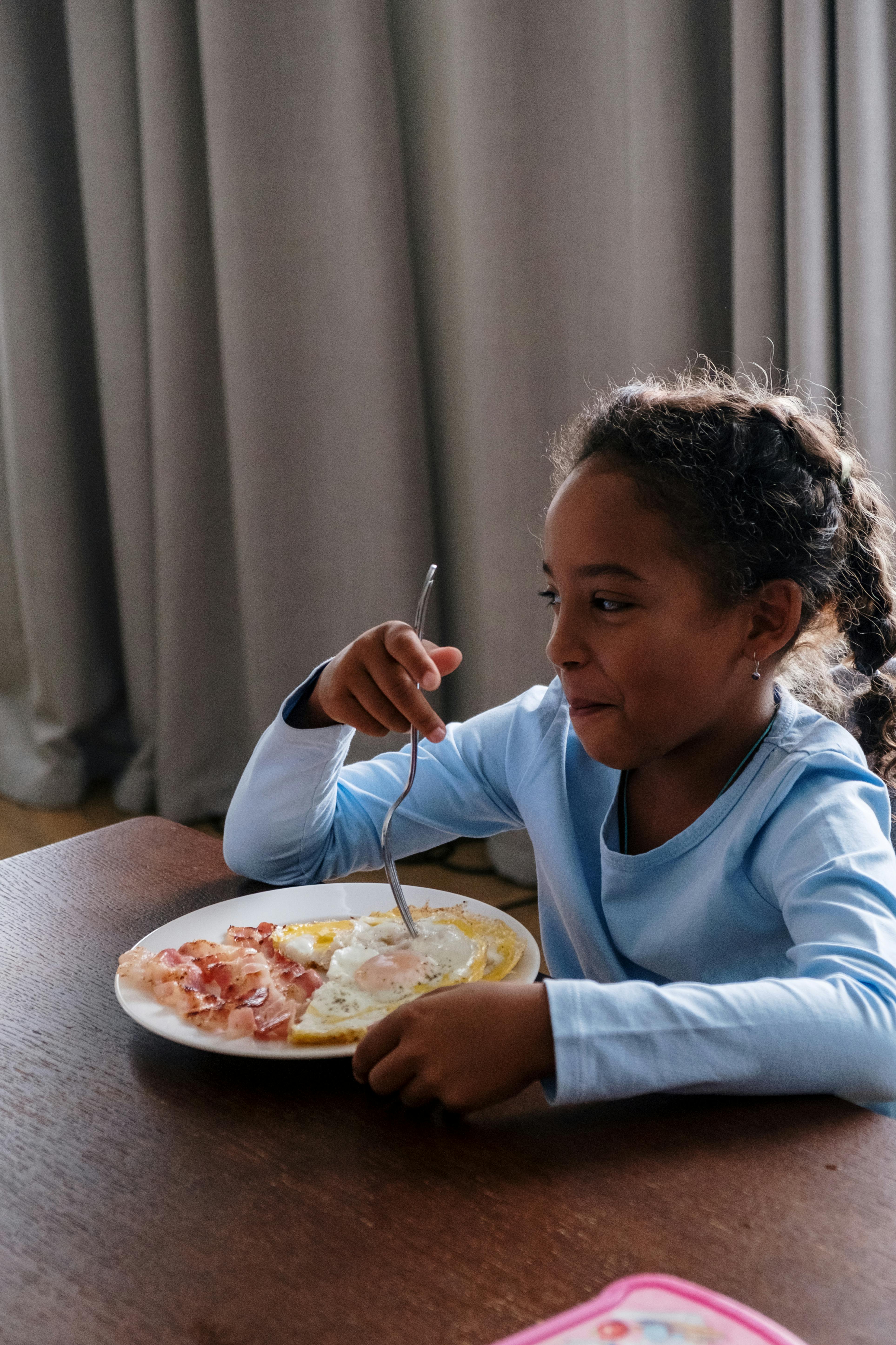 indian child eating breakfast