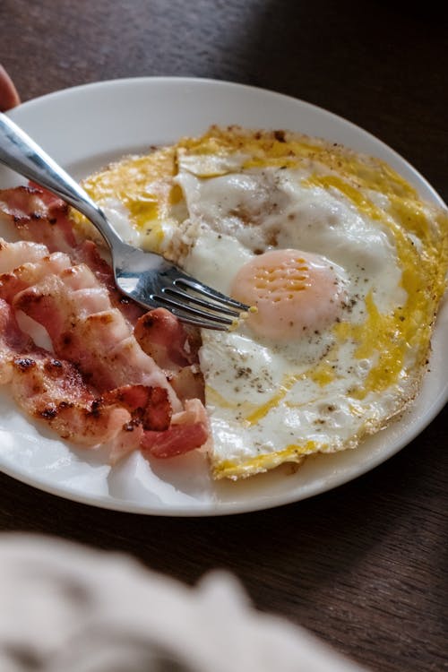 Free Fried Egg and Bacon on the Plate Stock Photo