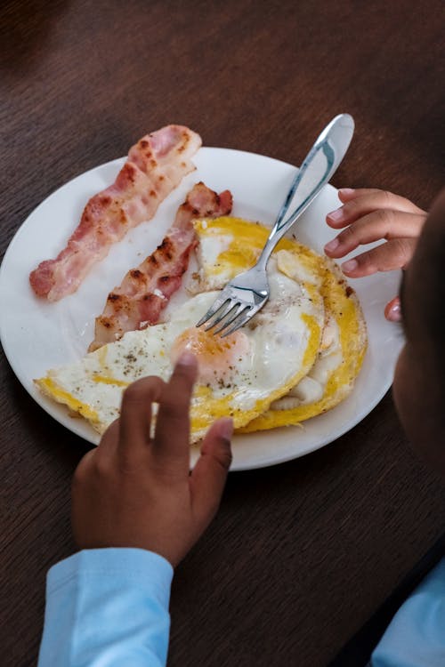 Free Fried Egg and Bacon on the Plate Stock Photo