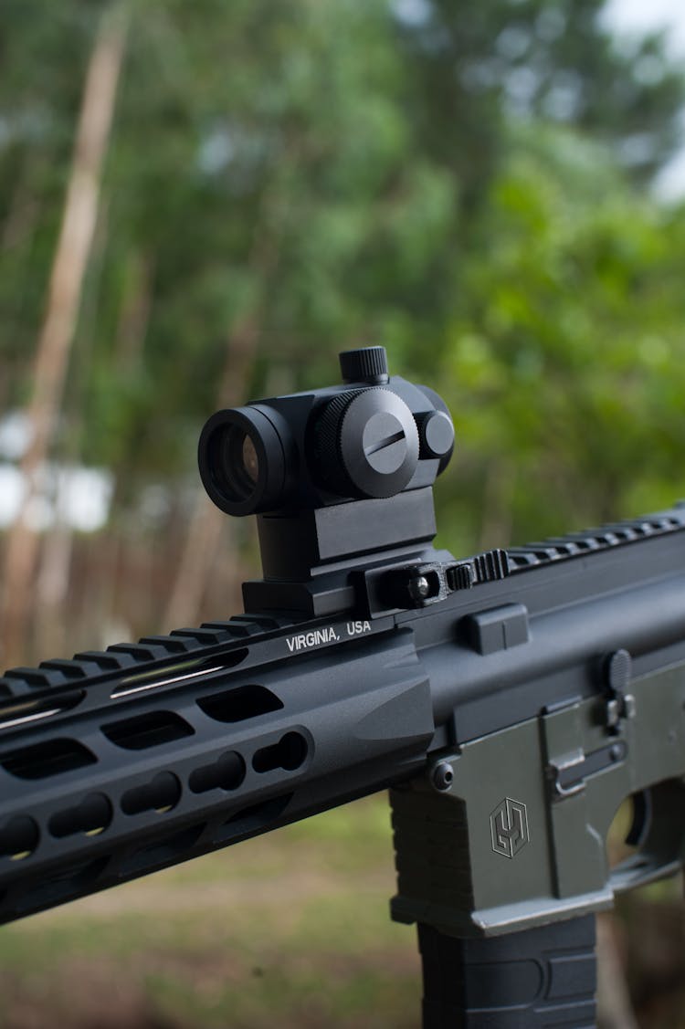 Close Up Shot Of Black Rifle With Scope