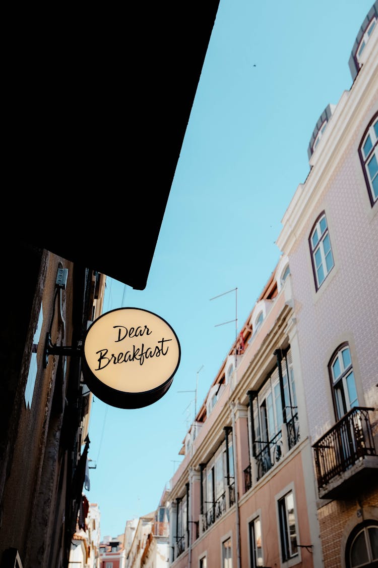 A Dear Breakfast Signage On Brown Wall