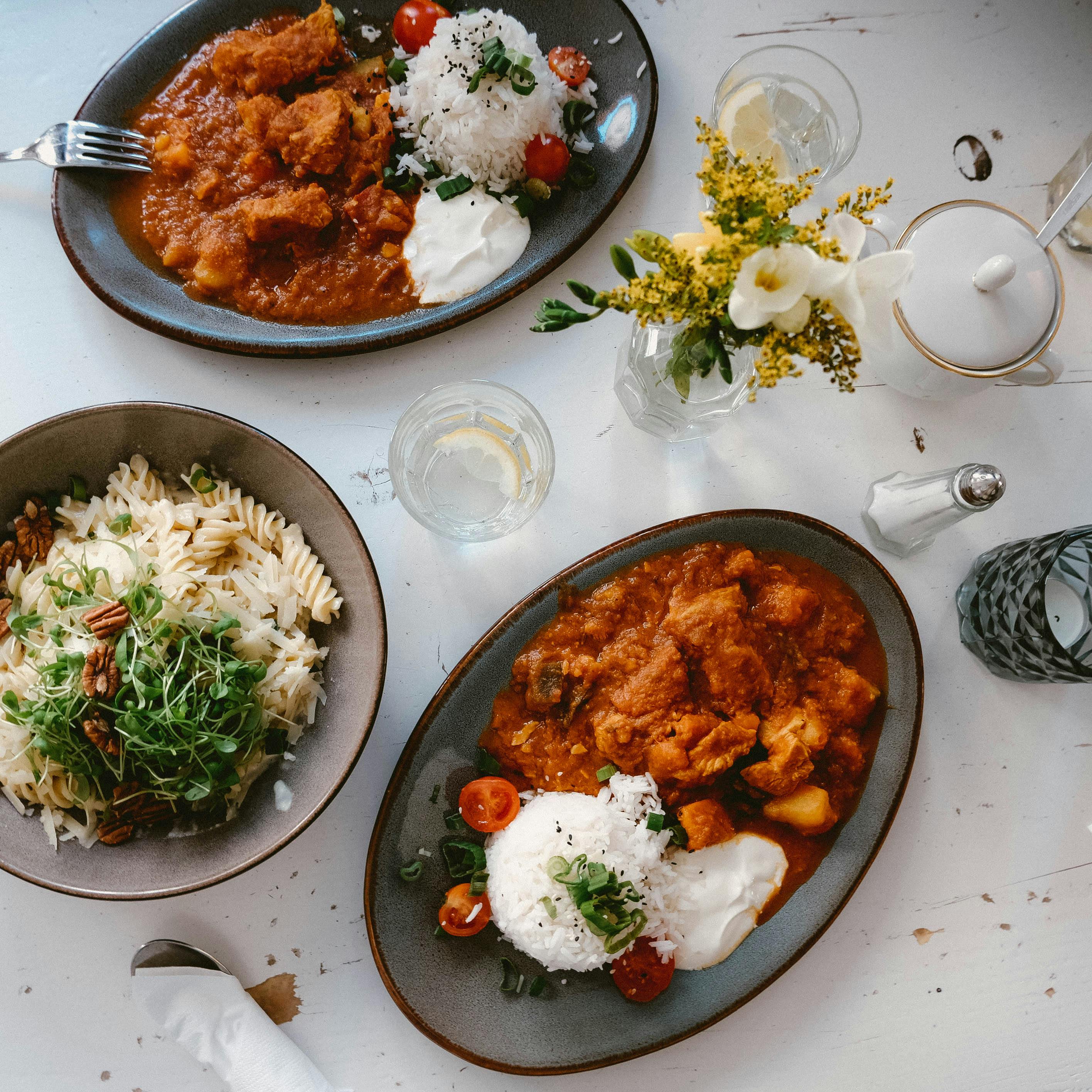 Cooked Food on Black Ceramic Plate · Free Stock Photo