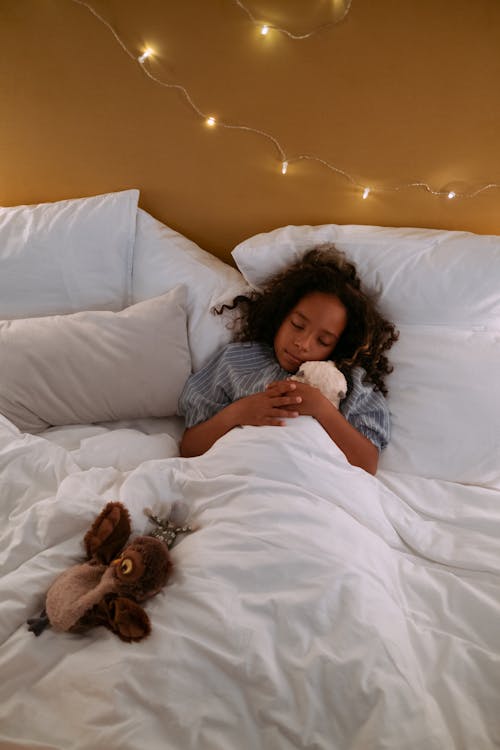 Free Photo of Girl Sleeping on Bed Stock Photo