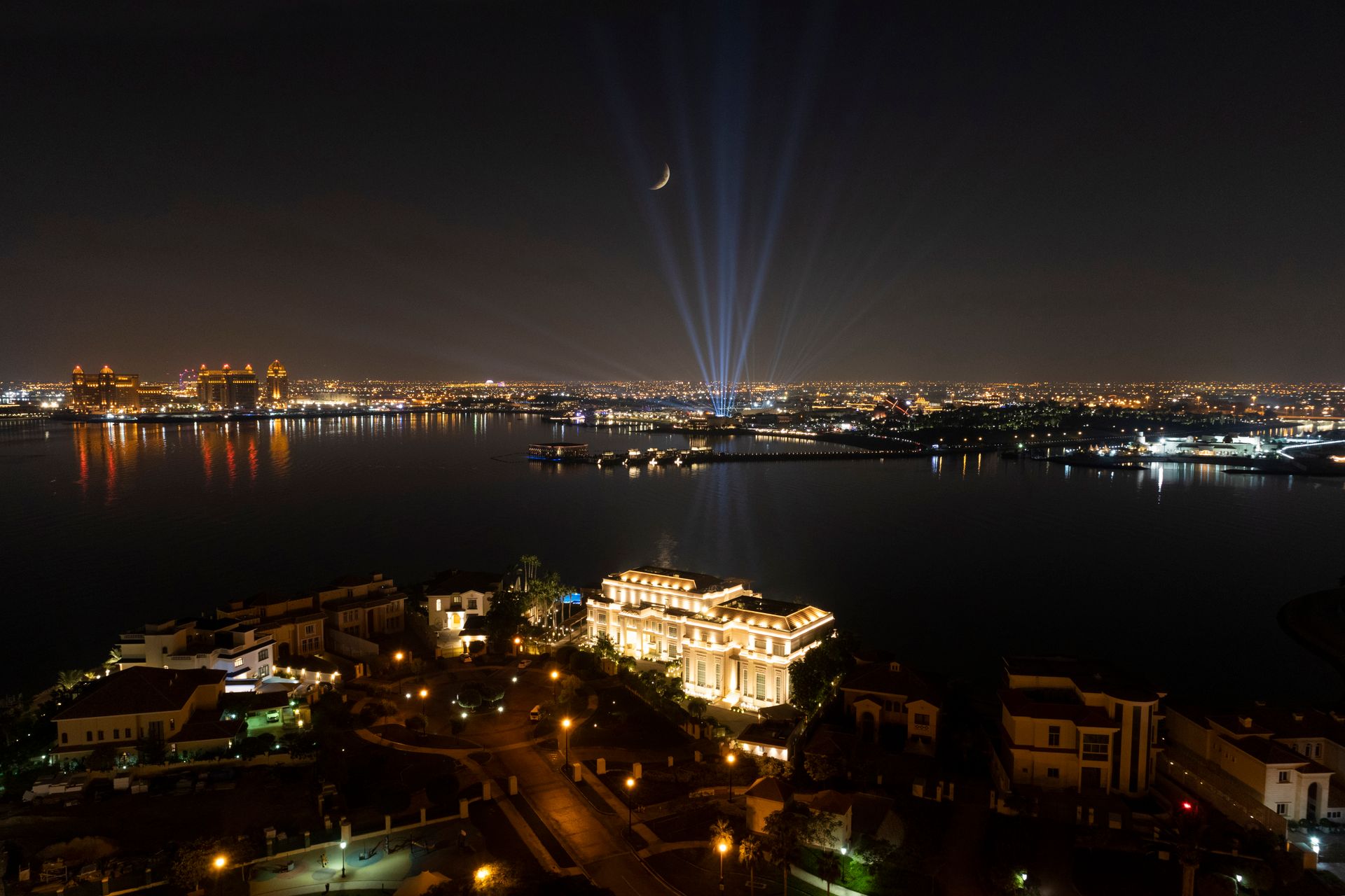 City lights reflected on water at night