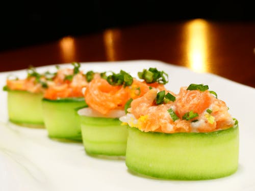 Free Sushi Wrapped in Cucumber on the Plate Stock Photo