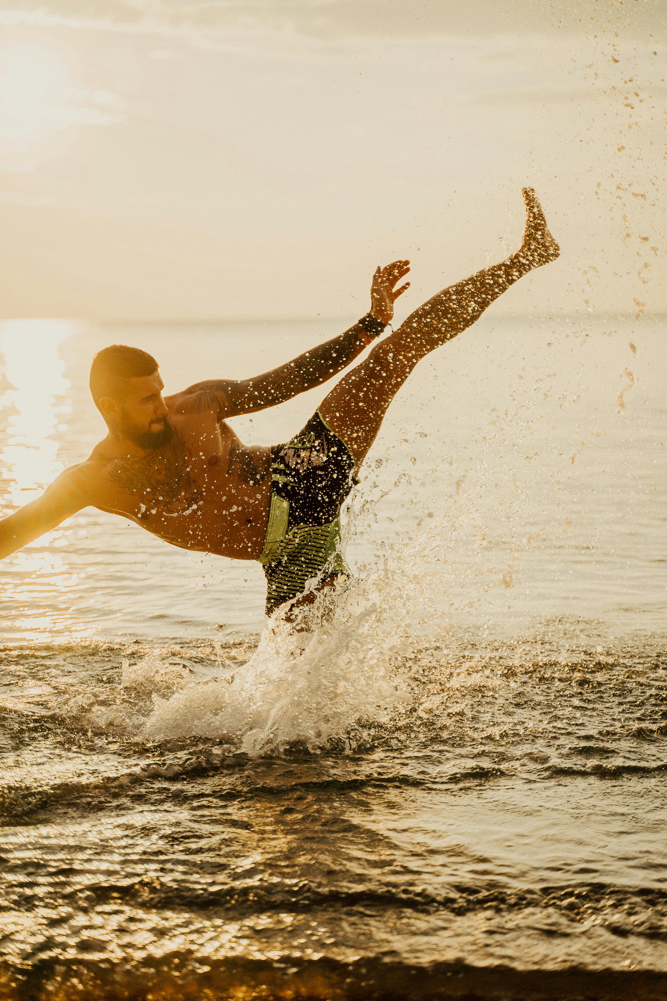 a man kicking on the water