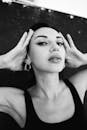 Grayscale Photo of a Woman in Black Tank Top