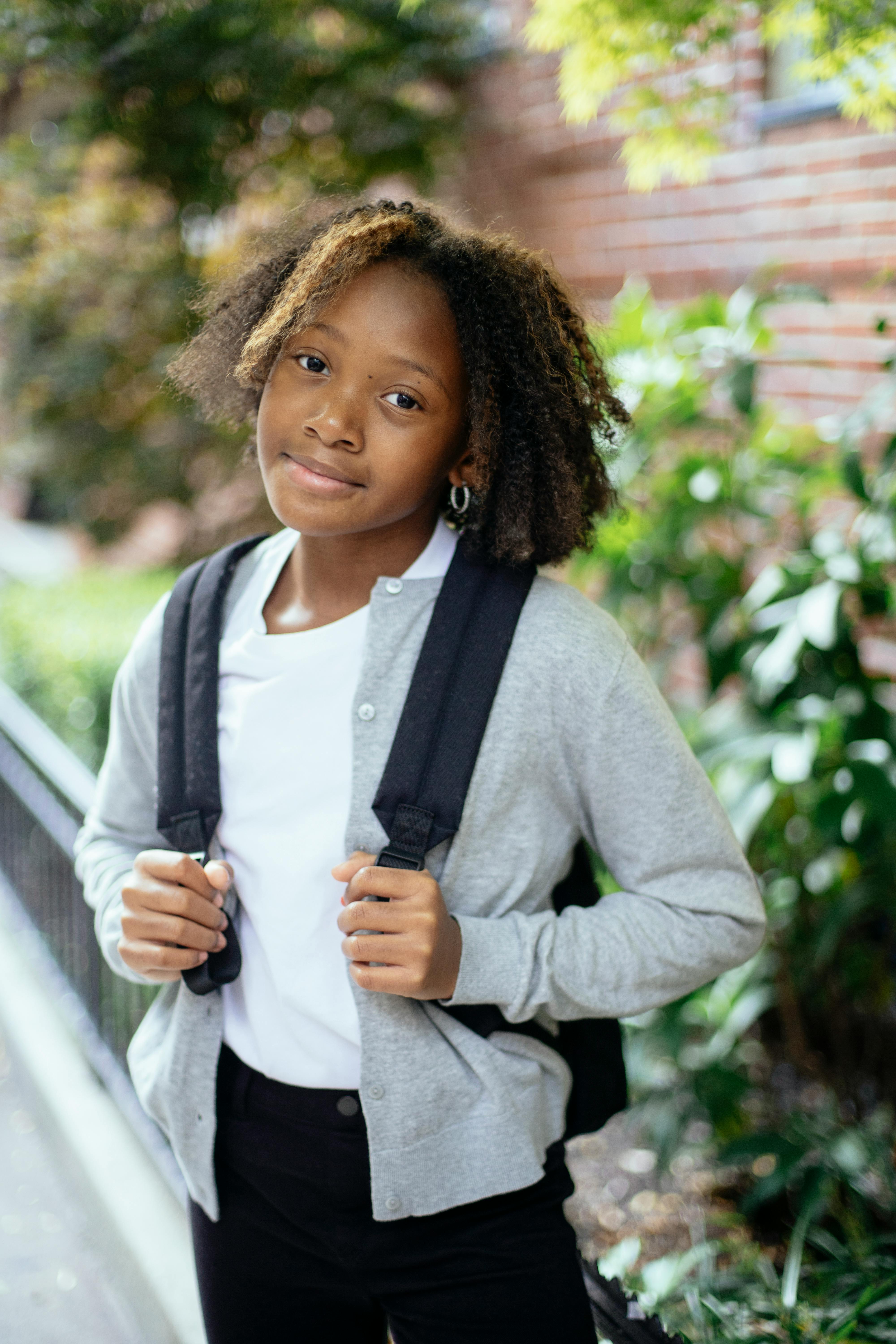 cute happy black girl smiling on street