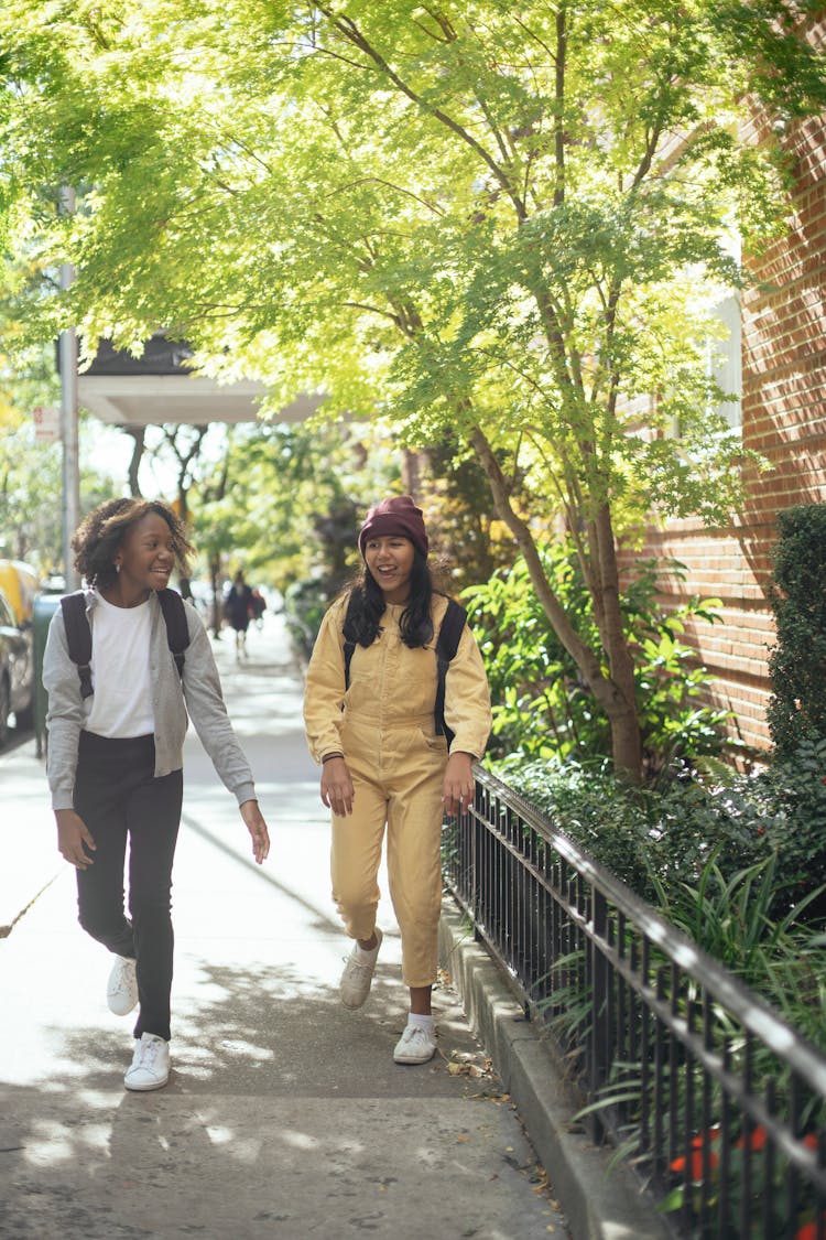 Cheerful Diverse Girls Walking Home